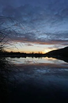 Water reflection sunset Stock Photos