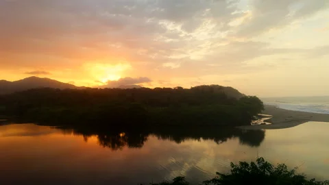 Water reflections are still and deep and the jungle goes into its sleep Stock Footage 344366862