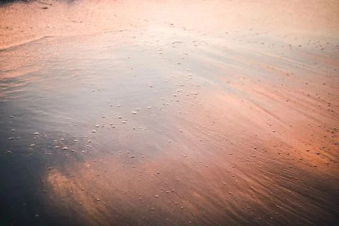 Water reflections on a beach Stock Photos