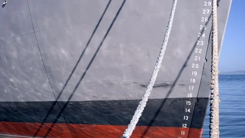 Water reflections on the hull of a docked ship Stock Footage 122376262