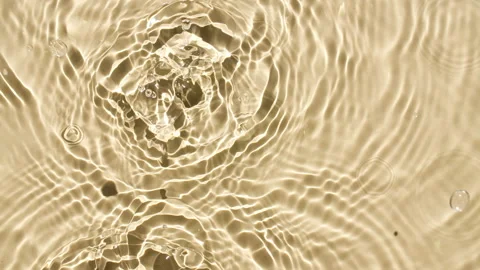 Water with reflections sunlight and shadows. Slow motion of drop falls into Stock Footage 220939091