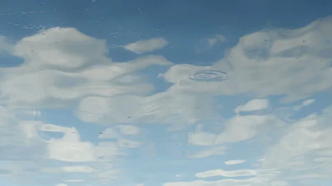 Water reflects sky with clouds Stock Footage 114695162