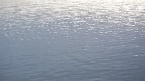 Water reflects sun light in a bright day Stock Footage 61577643