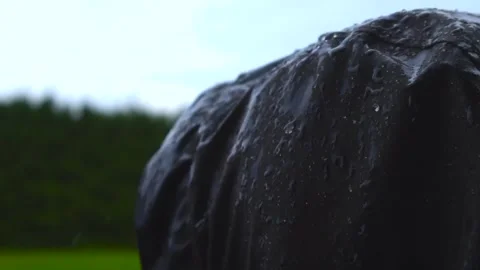 Water Resistant Hooded Jacket in the Rain with Slow Motion Droplets Stock Footage 340187658