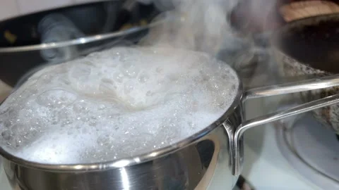 Water with rice is boiling in the pot Stock-Footage 221427887