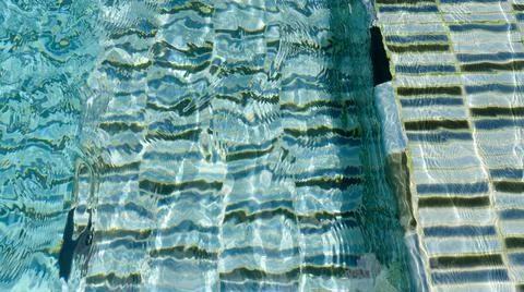 Water ripple pattern in pool on sunny day Stock Photos