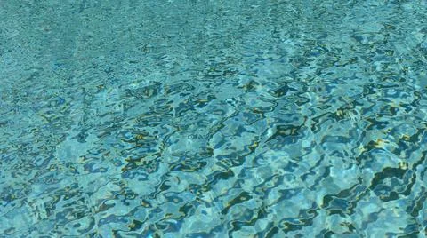 Water ripple pattern in pool on sunny day Stock Photos