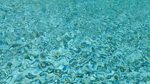 Water ripple pattern in pool on sunny day Stock Photos