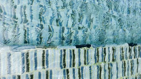 Water ripple pattern in pool on sunny day Stock Photos
