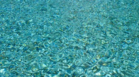 Water ripple pattern in pool on sunny day Stock Photos