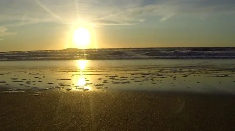 Water ripples across a lake during a sunrise. Stock Footage 59339395