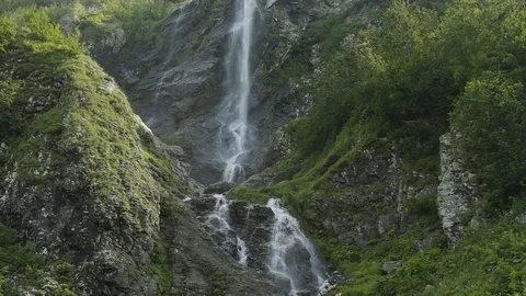 Water river falling from inside a waterfall in slow motion. Waterfall in the Stock Footage 115160779