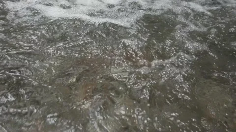 The water of the river flows slowly over the rocks Stock Footage 253219230