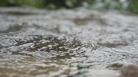 The water of the river flows slowly over the rocks Stock Footage 253219619