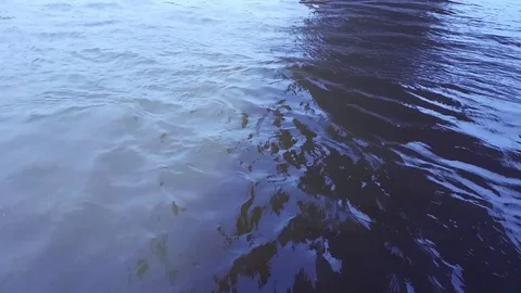 Water in a River rippling with waves in 4K 스톡 동영상 74016921