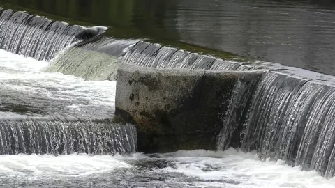 Water river rushing weir waterfall fllowing Stock Footage 74699559