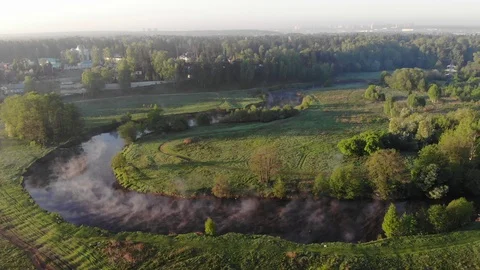The water in the river soars at dawn in the morning. Aerials view Stock Footage 93389331