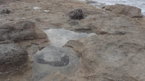 Water on rock beach Stock Footage 127871177