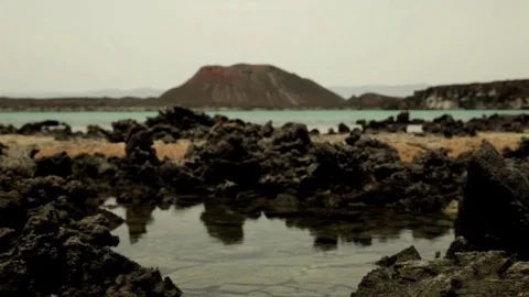 Water, rocks and volcano Stock Footage 73664591