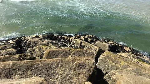 Water on the rocks on the beach Video stock 137941862