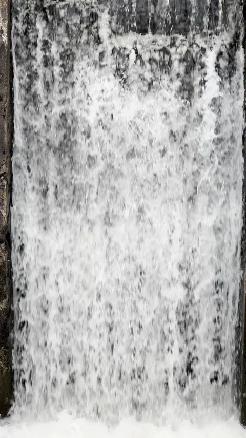 Water running in artificial waterfall, vertical Stock Footage 236897894