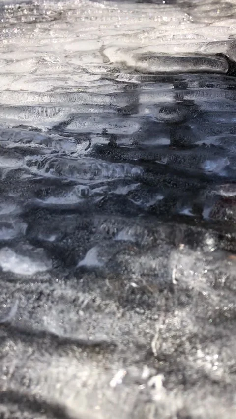 Water running beneath ice 库存影片 243240782