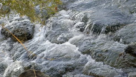 Water running between the stones Stock Footage 115587954