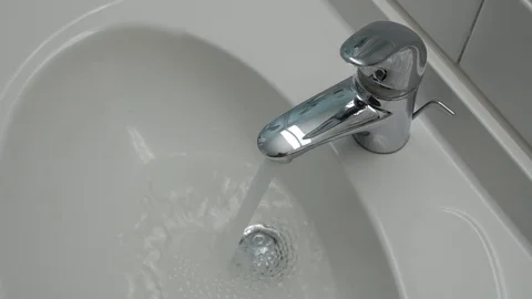 Water running continuously from water tap Stock Footage