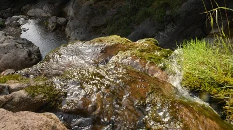 Water running down a cliff Stock Footage 8624301