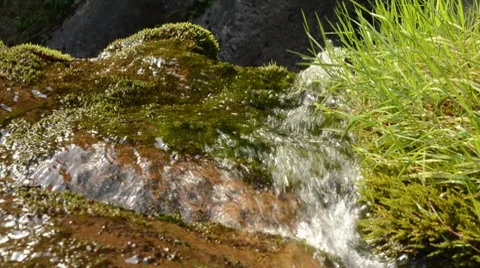 Water running down a cliff with pan Stock Footage 8624136