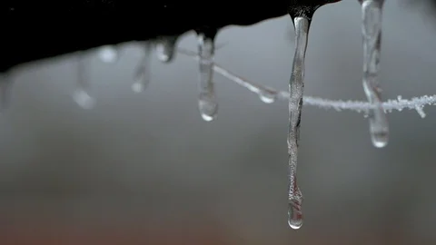 Water running down an icicle Stock Footage 102410836