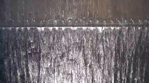 Water Running Down Rivets on a Metal Sheet Stock Footage 46010917