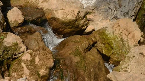 Water running  down rocks Stock Footage 8623569