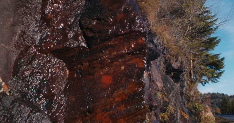 Water running down rocks in a Scenic Mountain View 4k Stockbeeldmateriaal 144431056