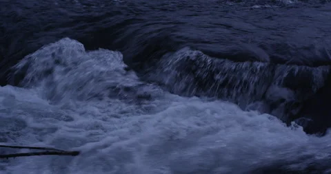 Water running fast passing rocks in mountain river. Stock Footage 147634091
