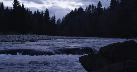 Water running fast passing rocks in mountain river. Stock Footage 147634442