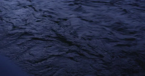 Water running fast passing rocks in mountain river. Video stock 147634590