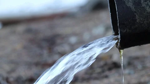 Water running out of drain pipe into lake, Finland Stock Footage 108649085