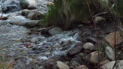 Water running over rocks in a stream Stockbeeldmateriaal 153947963