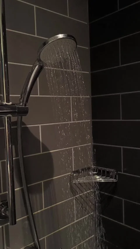 Water running from a silver shower head Video stock 313793828