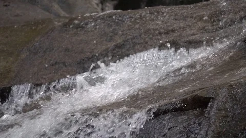 Water running of a slanted rock Stock Footage 88003668