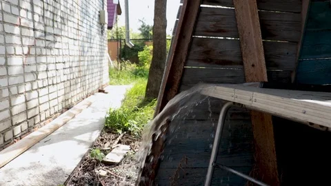 Water running on the table in the outbuilding. Stock Footage 110772431