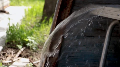 Water running on the table in the outbuilding. Stock Footage 110772441