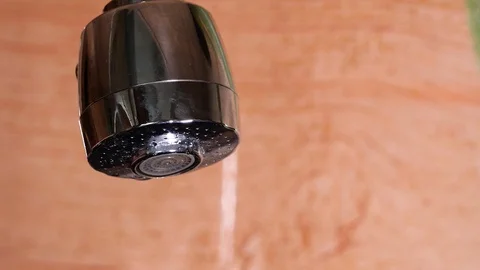 Water running from a tap into a sink. Stock Footage 116764645