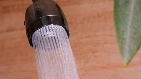 Water running from a tap into a sink. Stock Footage 116764682
