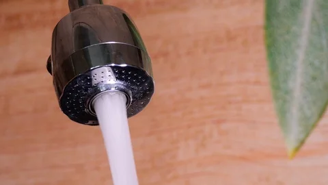 Water running from a tap into a sink. Stock Footage 116764751