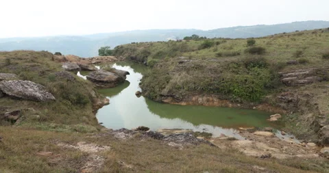 Water running Through mossy rocks Видео 335428297