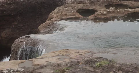Water running Through mossy rocks Stock Footage 335632731