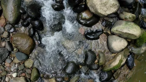 Water is running through the rocks, a background with fresh water and rocks Stock Footage 160313656