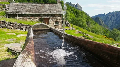 Water running in trough in the mountains Stock Footage 32328170